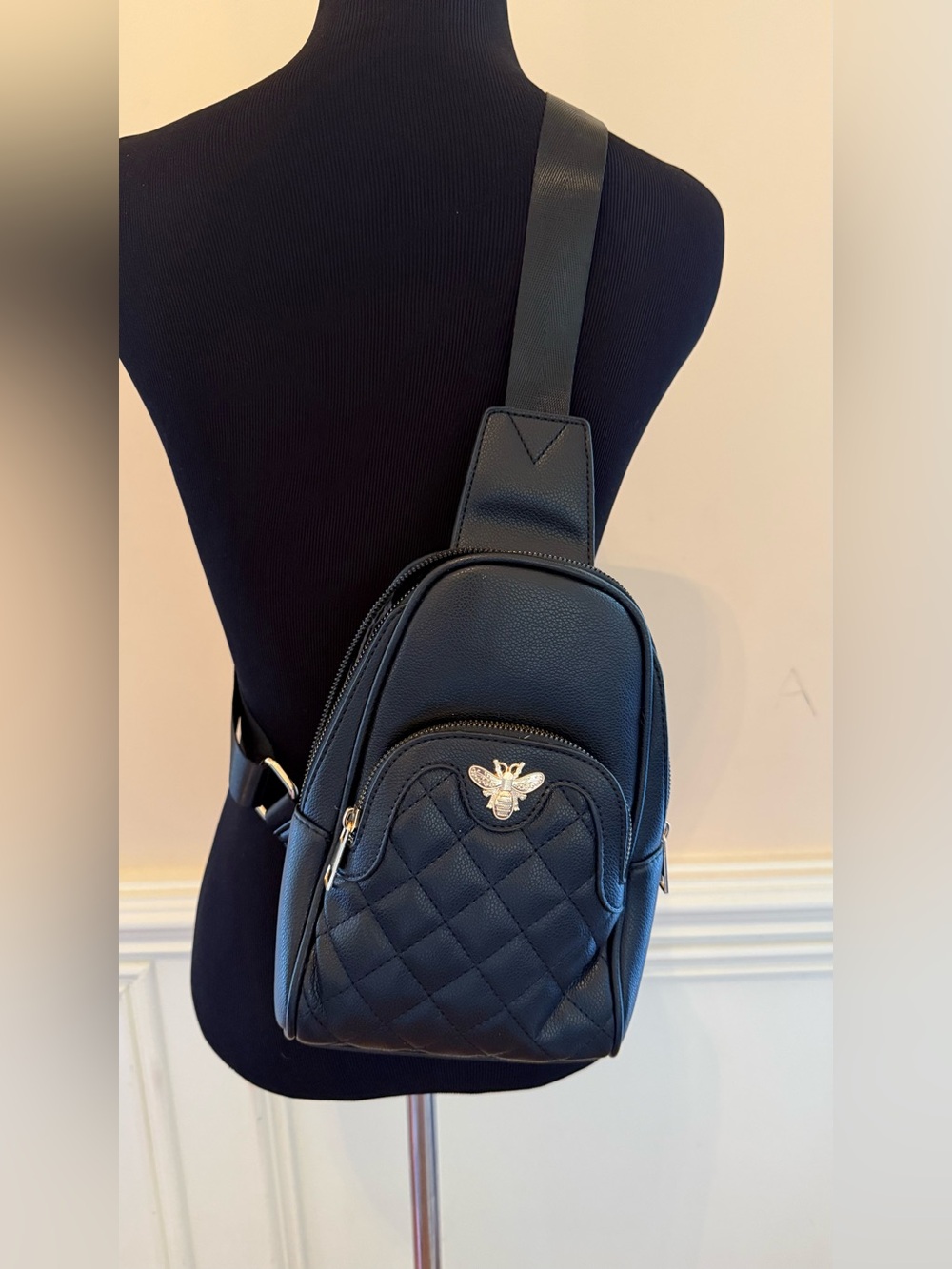 Black Quilted Sling Crossbody Bag with Gold Bee Emblem